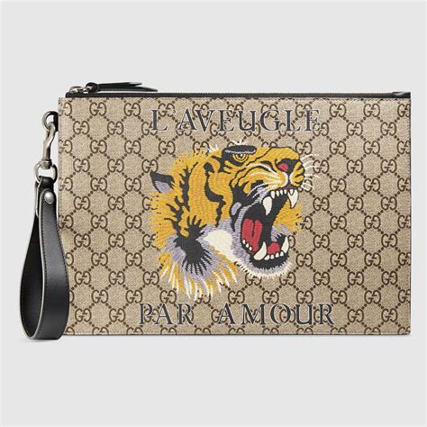 pochette gucci uomo tigre|GUCCI PORTAFOGLIO IN TESSUTO GG SUPREME CON .